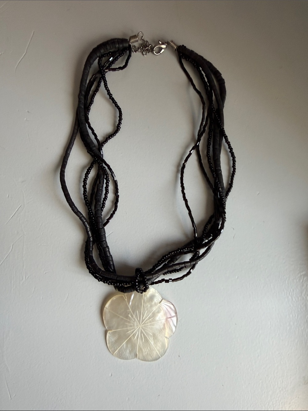 Black Multi-Strand Necklace with Iridescent Flower Pendant